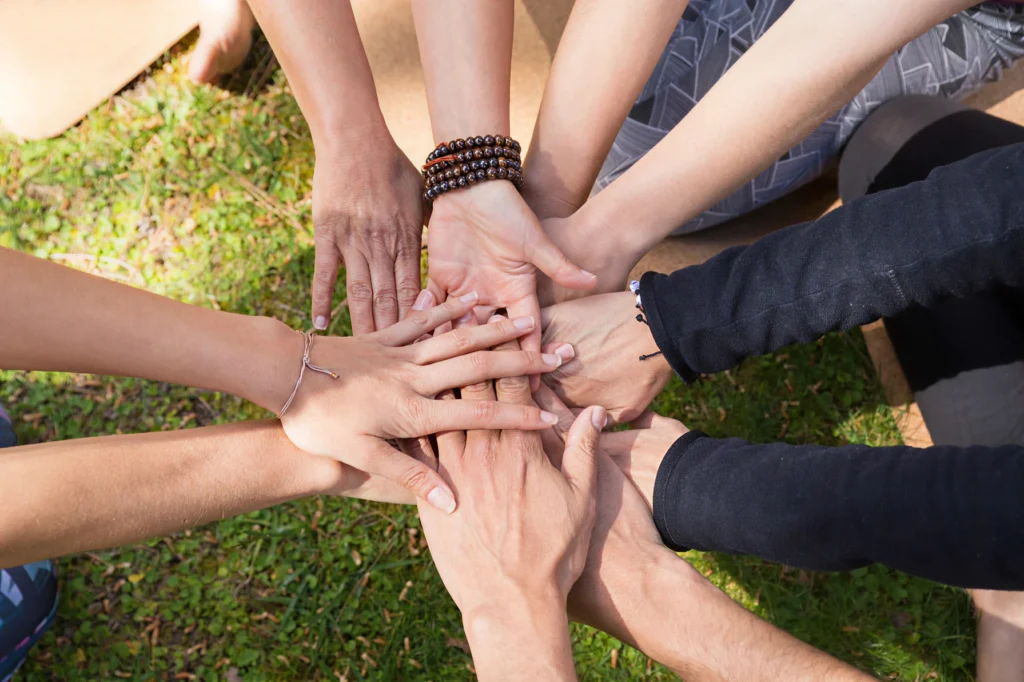 hands piled together from a group of people